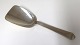 Hans Hansen. 
Silver (830). 
Arvesölv no.4. 
Sugar spoon. 
Length 12 cm.