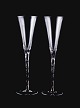 Danish glass artist, two champagne flutes in art glass covered with silver 
inlays in the stem.