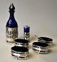 English 
salt/pepper 
set, 19th 
century. Silver 
plated with 
blue glass. 
Consisting of 4 
salt pans, ...