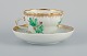 KPM, Berlin.
Chocolate cup hand painted with green flowers and gold decoration.