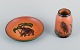 Ipsens Enke, 
ceramic vase 
and a ceramic 
dish.
Malibu and 
elephant motif.
Glaze in 
orange-green 
...