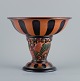 Ipsens, 
Denmark, Art 
Nouveau faience 
compote, 
decorated with 
foliage and 
flowers.
Approx. ...