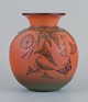 Ipsens, 
Denmark, vase 
with flowers 
and butterfly.
Glaze in 
orange and 
green ...