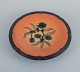 Ipsens, 
Denmark, 
ceramic bowl 
with floral 
motif.
Glaze in 
orange-green 
shades.
Model number 
...