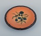 Ipsens, Denmark, ceramic bowl with floral motif.
Glaze in orange-green shades.