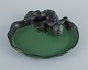 Ipsens, 
Denmark. Rare 
dish in 
hand-painted 
glazed ceramic 
with a lizard.
Model number 
...