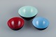 Three bowls in metal.
Blue, red and mint green.