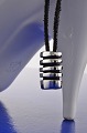 Georg Jensen 
"Strata" 
Pendant silver 
with leather 
cord. Pendant, 
length 2 x 1.6 
cm. String, ...