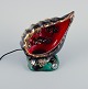 Vallauris, France. Decorative table lamp in glazed ceramic shaped like a conch. 
Hand painted ceramics.