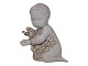 Blanc de chine 
Bing & Grondahl 
figurine, sea 
child decorated 
with gold.
The factory 
mark ...