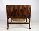 This vintage sewing table / bar table on rosewood legs is a fantastic example of Danish ...