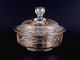 French Lidded 
bowl in 
mouth-blown 
glass with 
faceted motifs 
and gold 
decoration.
Approx. ...