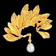 Jean Larsen; A pendant of 18k gold, leaves set with a white pearl.H. 3,5 cm. W. 3,5 cm.Jean ...