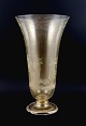 Murano, Italy, large trumpet-shaped floor vase in clear glass with gold 
decoration. Mouth blown. Motif with courting couple.