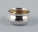 Evald Nielsen, 
hammered salt 
cellar in 
Danish 830 
silver.
1923.
Marked.
In good 
condition, ...
