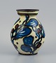 Kähler, HAK, ceramic vase with flower decoration in cow horn technique.
Blue and black flowers on light background.