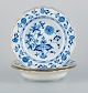 Meissen, Germany, a set of three deep plates, Blue Onion pattern porcelain 
plates with gold rim.