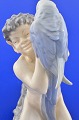 Royal 
Copenhagen 
porcelain. 
Royal 
Copenhagen 
figurine, Faun 
with parrot no. 
752. Height 18 
cm. 7 ...