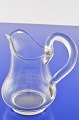 Creamer of 
clear glass. 
Creamer, Height 
10,8 cm. Height 
at handle 12 
cm. Fine 
condition.