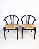 A pair of 
chairs in 
Nordic design 
with natural 
wicker seat 
made in black 
lacquered beech 
wood by ...