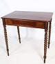 Mahogany side 
table with 
drawer in the 
middle and 
round legs from 
around the ...