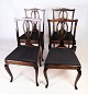 Dining room chairs in mahogany with a nice cutout in the backrest with black patterned fabric ...