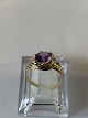 Women's ring 
with purple 
stones in 14 
carat gold
Size 58