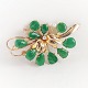 W. & S. 
Sørensen; A 
brooch set with 
jade, a diamond 
and pearls 
mounted in 14k 
gold.
App. 5,5 cm 
...