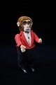 Old Schuco 
monkey in fine 
fabric clothes.
Height: 
12,5cm. 
(without key)