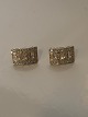 Earrings in 14 karat gold with clear stones