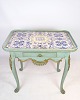 Painted rococo shaped tile table decorated with various motifs. The table is from the 1780s and ...