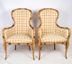 A pair of two 
armchairs in 
checked fabric 
with wooden 
frames from 
around the ...