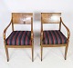 A pair of 
Danish Empire 
style 
hand-polished 
mahogany 
armchairs with 
striped fabric 
from around ...