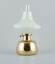 Henning Koppel for Louis Poulsen, Petronella oil lamp in brass with opaline 
glass shade.