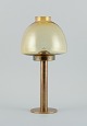 Hans-Agne Jakobsson (1919-2009), candlestick in brass and smoked glass.