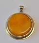 Polished milk 
amber pendant 
framed in 
silver, 1927 - 
1958. Russia. 
Stamped. H.: 
4.8 cm. Dia.: 4 
...