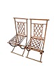 A set of two French iron chairs from around the 1950s with fine decoration.Measurements in cm: ...