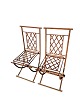 A set of two 
French iron 
chairs from 
around the 
1950s with fine 
decoration.
Measurements 
in cm: ...