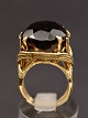 14 carat gold 
ring size 58 
weight 14.7 
grams with 
smoke topaz 2.4 
x 1.8 cm. 
subject no. 
534449