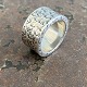 Wide sculptural 
ring of 
sterling 
silver. Ø 22 
mm. internal 
dimensions 16 
mm. Stamp 925s 
weight 15g