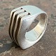 Wide sculptural ring of sterling silver. Ø 22 mm. internal dimensions 16 mm. Stamped 925s. ...