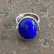 Sculptural ring of sterling silver with blue stone. . Internal dimensions 18 mm. Stamped 925s. ...