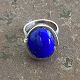 Sculptural ring 
of sterling 
silver with 
blue stone. . 
Internal 
dimensions 18 
mm. Stamped 
925s. ...