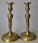A pair of French bronze candlesticks, 19th century. Foot and stem decorated with patterns. H.: ...