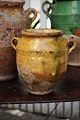 Decorative 
small 19th 
century clay 
jug with handle 
from the South 
of France with 
ocher yellow 
...