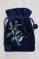 An antique 
beautiful 
handbag 
handmade ofdark 
blue 
fabric,/velour 
Decorated with 
...