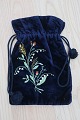 An antique beautiful handbag handmade ofdark blue 
fabric,/velour 
Decorated with handbroidery
The closing is made with a string
About 1880-1900
In a good condition