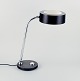 Charlotte 
Perriand, Jumo, 
French desk 
lamp in chrome 
and black 
lacquered metal 
with an ...