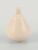 Gunnar Nylund for Rörstrand, Sweden, a small ceramic vase with a rare shape in 
cream-colored glaze.