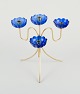 Gunnar Ander 
for Ystad 
Metall, a brass 
candle holder 
for four 
candles with 
blue candle ...